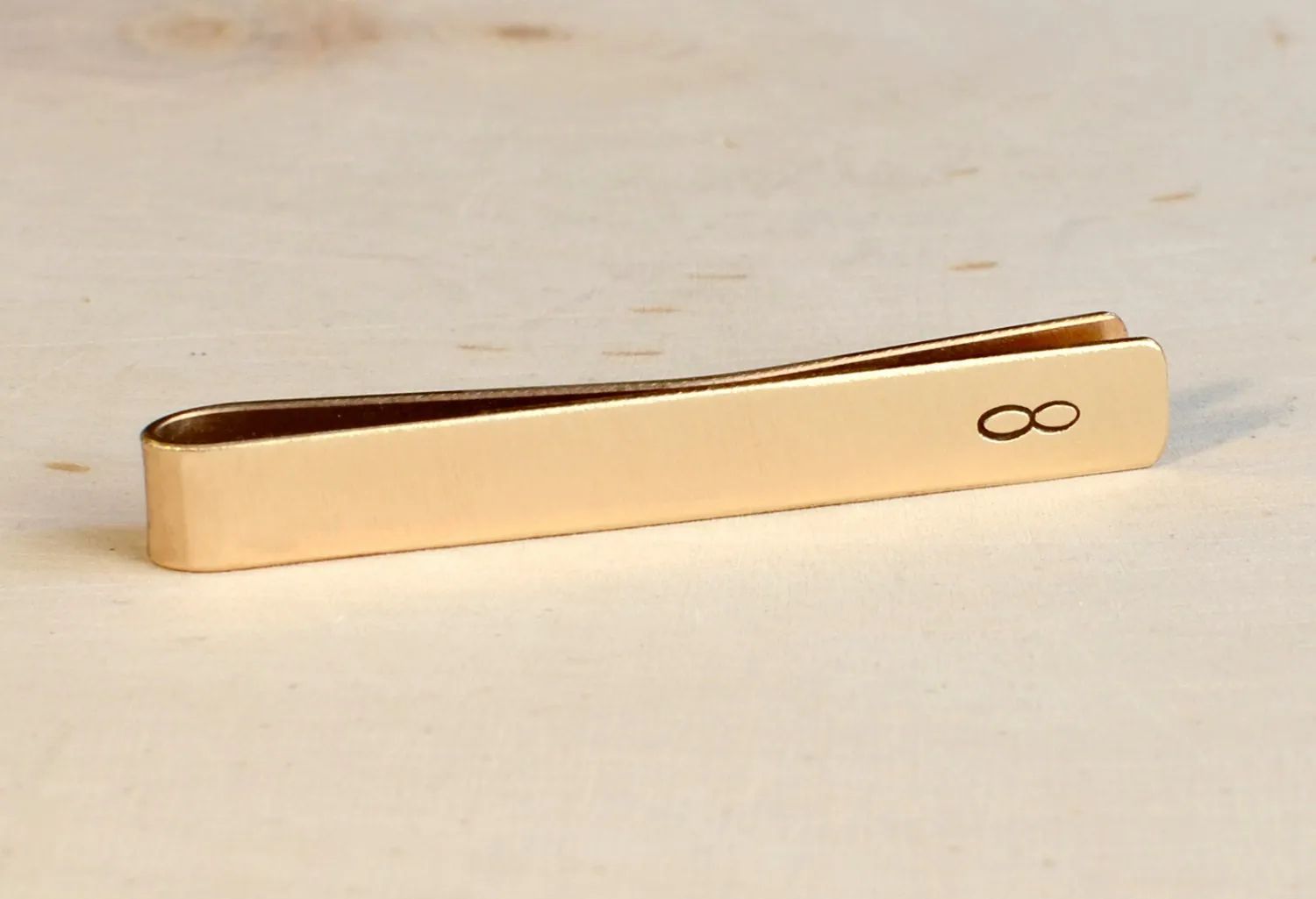 Infinity Brass Tie Clip